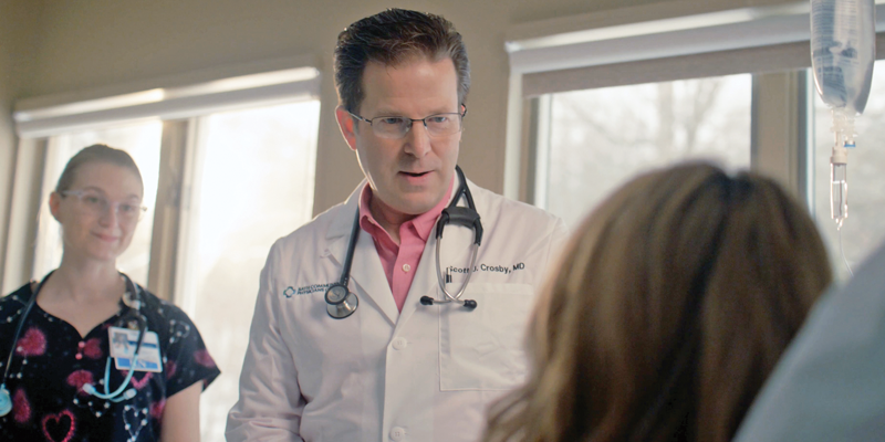 Dr. Crosby and nurse with patient