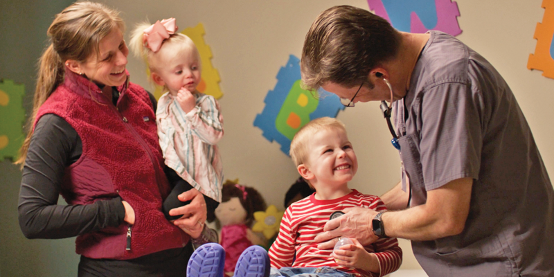 Dr. Crosby with pediatric patient at BCPG clinic